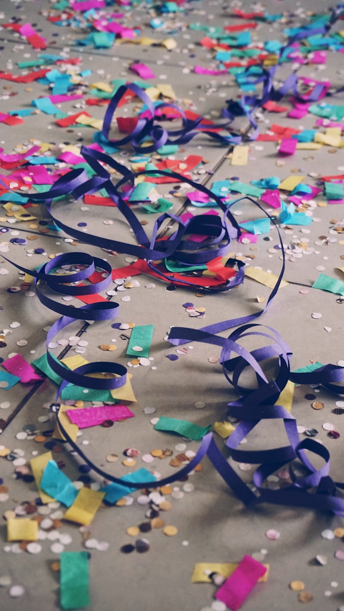Photo by Matheus Frade ribbons and confetti on floor